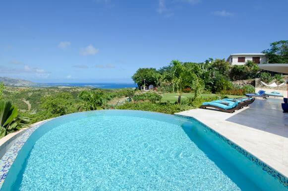 Villa On Island Time is a wonderful stylish, modern villa located in the gated Oyster Pond Hillside and has stunning views of the ocean, surrounding hillsides and Orient Bay.